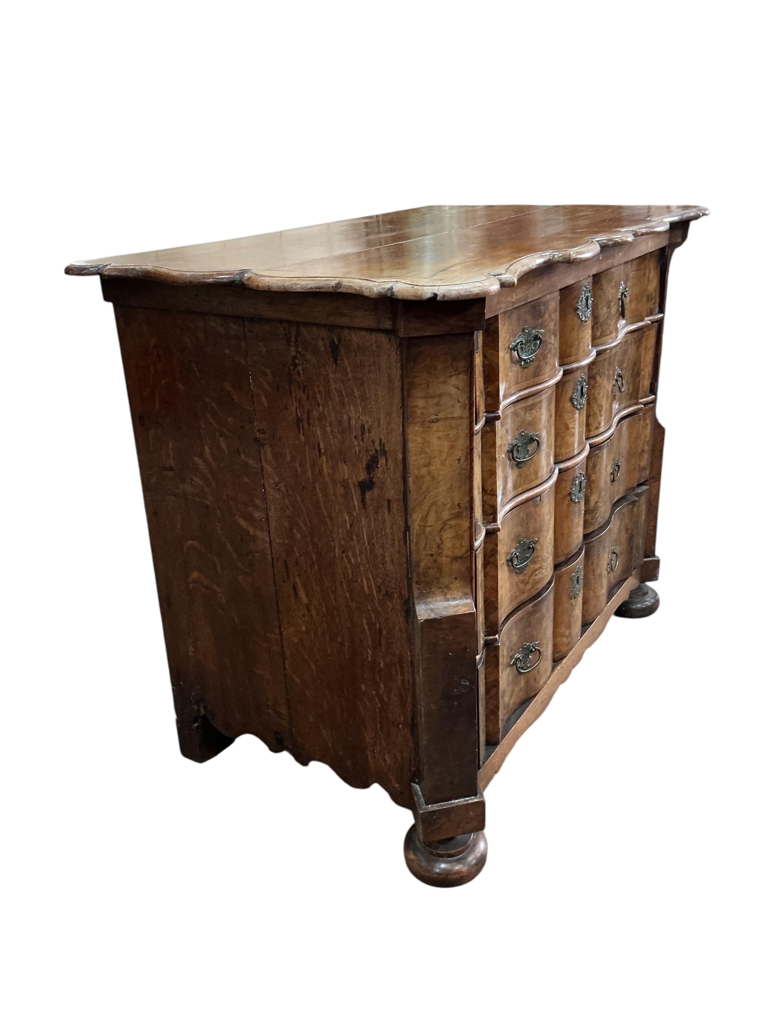 An 18th century Dutch walnut and oak serpentine chest, width 92cm, depth 57cm, height 78cm